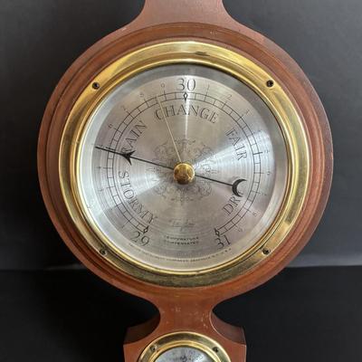 LOT 629: Brass Boston Ships Clock, C. Plath Hamburg Nautical Compass and Taylor Instruments Barometer