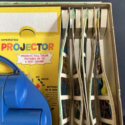 LOT 439: Vintage Kenner's Give a Show Projector, Electric EDU-QUIZ Vintage Educational Jacmar Game, 45 Jungle Book Records & More