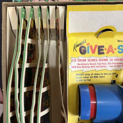 LOT 439: Vintage Kenner's Give a Show Projector, Electric EDU-QUIZ Vintage Educational Jacmar Game, 45 Jungle Book Records & More