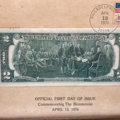 LOT 477: First Day of Issue Commemorating The Bicentennial April 13, 1976 Two Dollar Bill, U.S. Eisenhower One Dollar Coins and...
