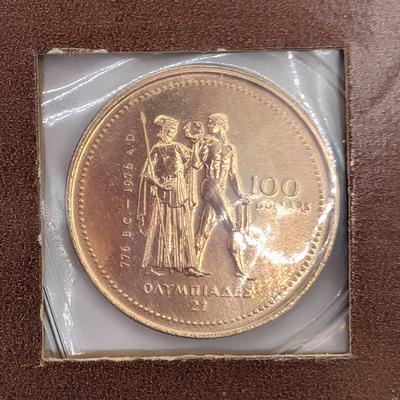 LOT: 480J Montreal 1976 Canadian Olympic 14K Gold, $100.00 Coin, (13.3g)