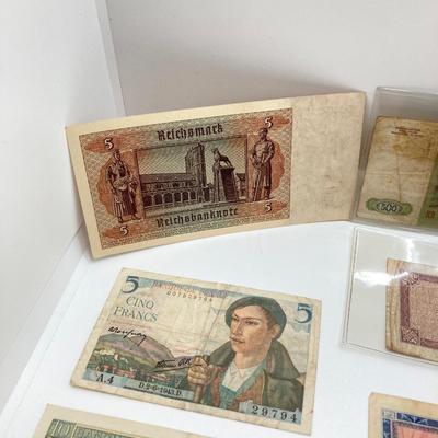 LOT 538: Large Collection of International Paper Currency