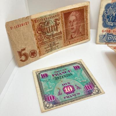 LOT 538: Large Collection of International Paper Currency