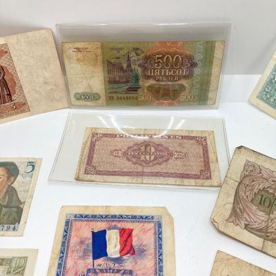 LOT 538: Large Collection of International Paper Currency