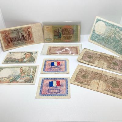 LOT 538: Large Collection of International Paper Currency