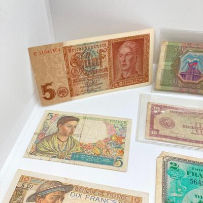 LOT 538: Large Collection of International Paper Currency
