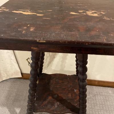 Small vintage table with coasters and candles