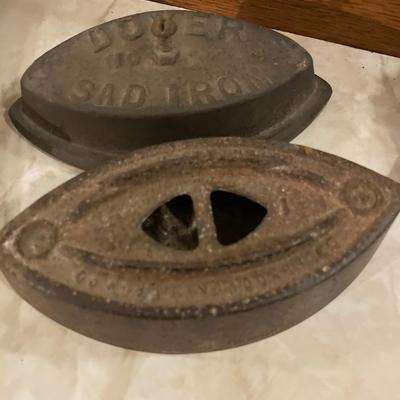 Vintage irons, coasters and books