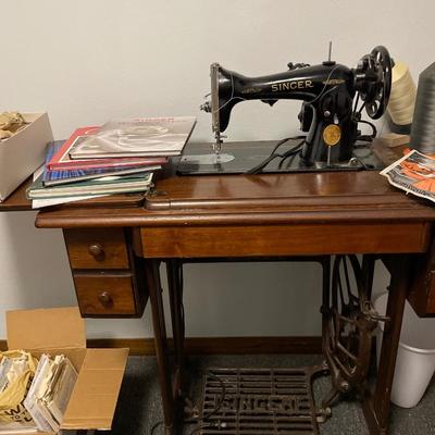 Antique Singer sewing machine with box of accessories