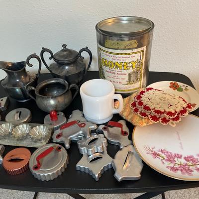 Silver plate, cookie cutters, honey can and plates
