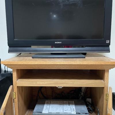 Sony TV on end table with Magnovox VHS/DVD