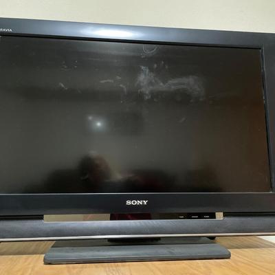 Sony TV on end table with Magnovox VHS/DVD