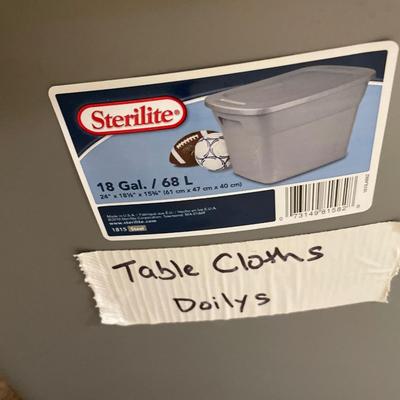 Tote of table cloths and doilies