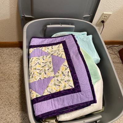 Tote of table cloths and doilies