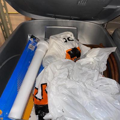 Copper tubes and plumbing items in tote