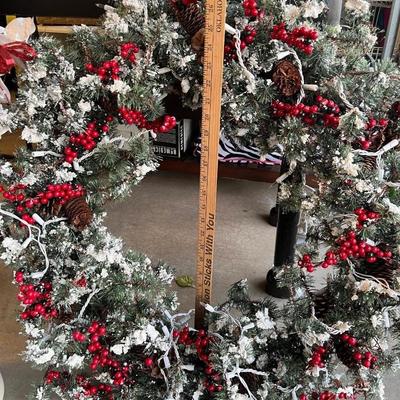 Large frosted tip wreath with electric lights
