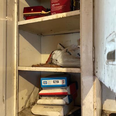 Top cabinet full of items