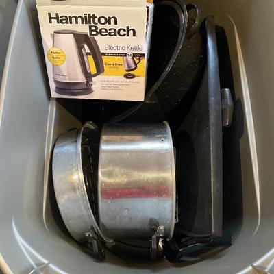 Large grey tote with griddle, kettle & pots