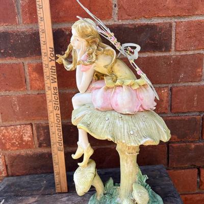Fairy statue and stepping stone
