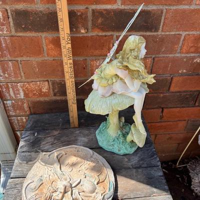 Fairy statue and stepping stone