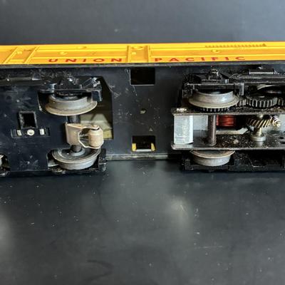 LOT 641: Lionel Train Set: Union Pacific Locomotive #1065, Savings Back Box Car #6050 Bank/Train Car, Explosives Box Car #6470, Flatbed...