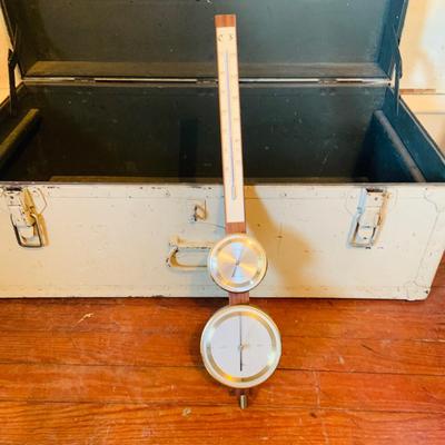 LOT 664: Doehler White Foot Locker, GE Electric Westminster Chime Mantle Clock, Air Guide Wood Wall Weather Station and Banjo Barometer