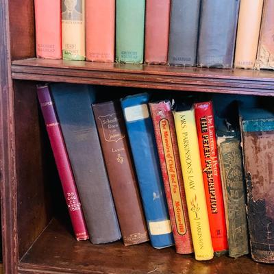 LOT 667: Bookcase with Classic Books, Mantle Weather Station, Side Table with Shelf and Anniversary Clock