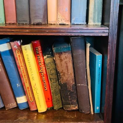 LOT 667: Bookcase with Classic Books, Mantle Weather Station, Side Table with Shelf and Anniversary Clock
