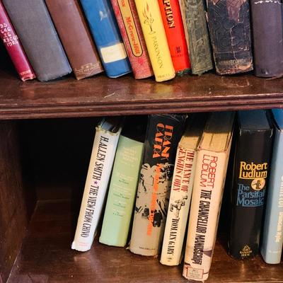 LOT 667: Bookcase with Classic Books, Mantle Weather Station, Side Table with Shelf and Anniversary Clock