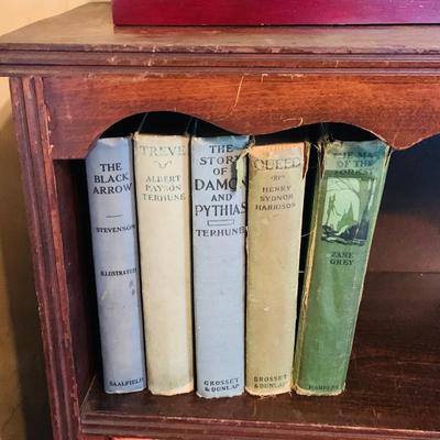 LOT 667: Bookcase with Classic Books, Mantle Weather Station, Side Table with Shelf and Anniversary Clock