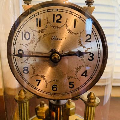 LOT 667: Bookcase with Classic Books, Mantle Weather Station, Side Table with Shelf and Anniversary Clock