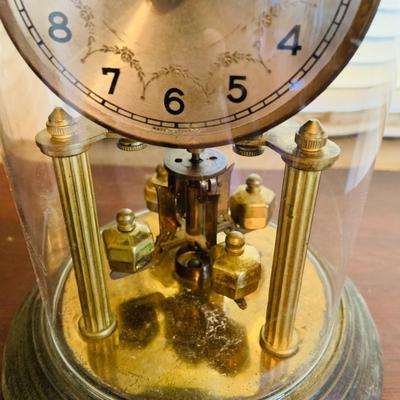 LOT 667: Bookcase with Classic Books, Mantle Weather Station, Side Table with Shelf and Anniversary Clock