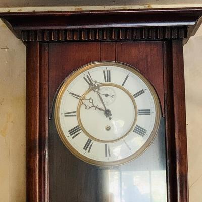 LOT 670: Large Wood Pendulum Wall Clock