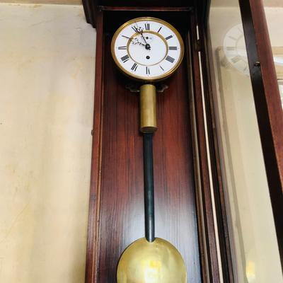 LOT 670: Large Wood Pendulum Wall Clock