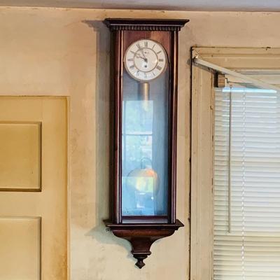 LOT 670: Large Wood Pendulum Wall Clock
