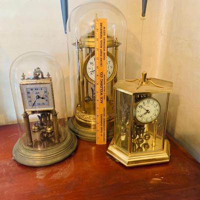 LOT 660: Three Anniversary Clocks by Kundo, Schultz and Other