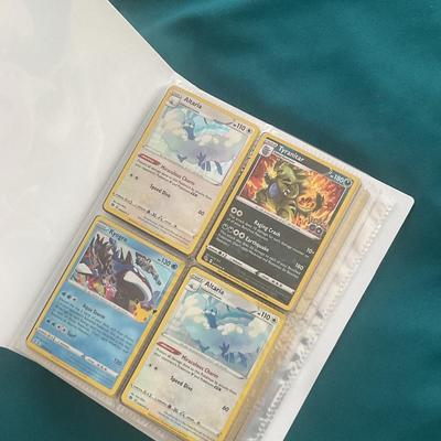 Binder of 100 Pokemon Cards, many Holos
