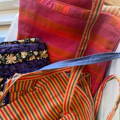 Small tote of vintage aprons
