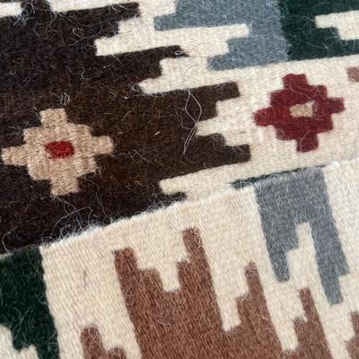 Mexican art, wool rug, and vintage trashcan