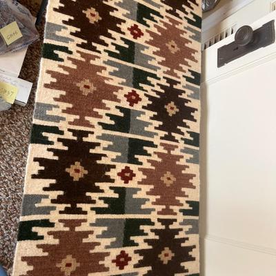 Mexican art, wool rug, and vintage trashcan