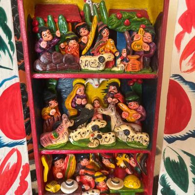 Mexican art, wool rug, and vintage trashcan