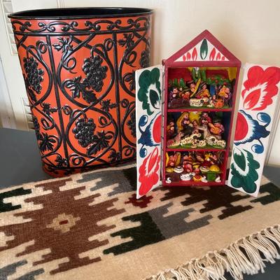 Mexican art, wool rug, and vintage trashcan