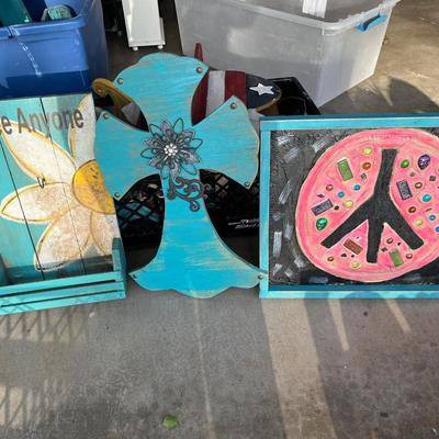 Painted cross, peace sign, and coffee sign