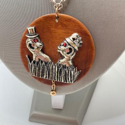 LOT 571: Vintage Jewelry Collection - Lady Nelson Antimagnetic Swiss Made Necklace Watch, Monkey Couple Medallion Necklace and Gold Tone...