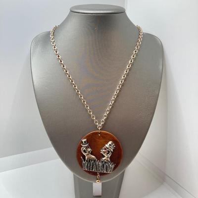 LOT 571: Vintage Jewelry Collection - Lady Nelson Antimagnetic Swiss Made Necklace Watch, Monkey Couple Medallion Necklace and Gold Tone...