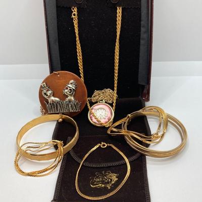 LOT 571: Vintage Jewelry Collection - Lady Nelson Antimagnetic Swiss Made Necklace Watch, Monkey Couple Medallion Necklace and Gold Tone...