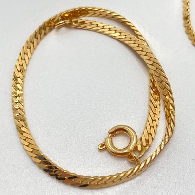 LOT 571: Vintage Jewelry Collection - Lady Nelson Antimagnetic Swiss Made Necklace Watch, Monkey Couple Medallion Necklace and Gold Tone...
