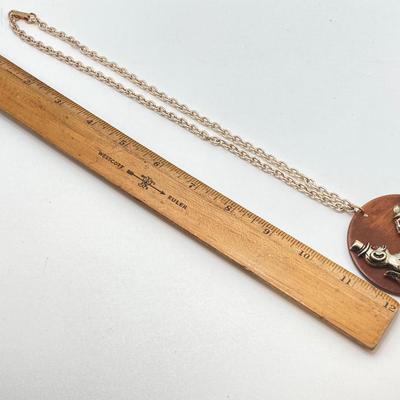 LOT 571: Vintage Jewelry Collection - Lady Nelson Antimagnetic Swiss Made Necklace Watch, Monkey Couple Medallion Necklace and Gold Tone...