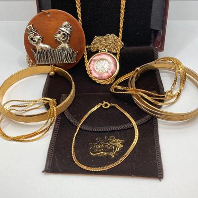 LOT 571: Vintage Jewelry Collection - Lady Nelson Antimagnetic Swiss Made Necklace Watch, Monkey Couple Medallion Necklace and Gold Tone...