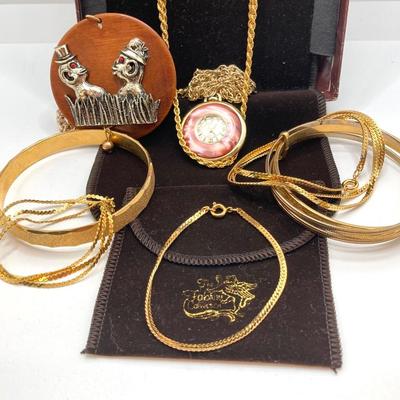 LOT 571: Vintage Jewelry Collection - Lady Nelson Antimagnetic Swiss Made Necklace Watch, Monkey Couple Medallion Necklace and Gold Tone...